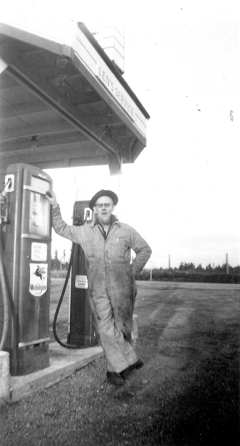 Len B. Lonning at Len’s Service in Wauna, 1950s.